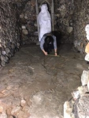 Surveying the newly exposed brick floor in the South Chamber